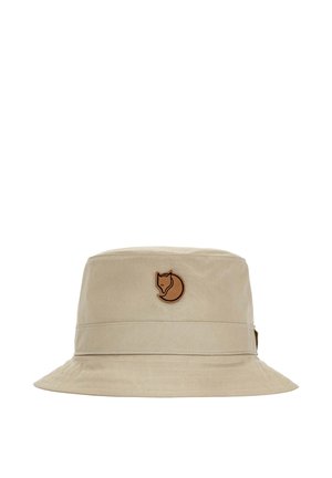 Chapeau bob beige avec large bord et patch logo renard marron centré à l'avant.