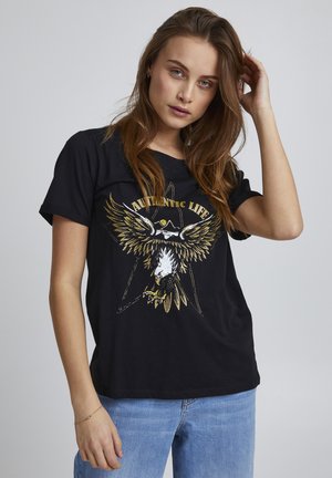 Svart t-shirt med ett guld- och vitt örn grafik och texten "AUTENTISKT LIV." Kort ärm, avslappnad passform, bomullsmaterial.