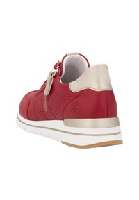 Red leather sneaker with perforated design, gold accents, and a white sole. Features a zip closure and a padded collar for comfort.