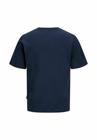 T-shirt en coton bleu marine avec un col rond, des manches courtes et un dos uni. Texture douce, coupe décontractée et fentes latérales à l'ourlet.