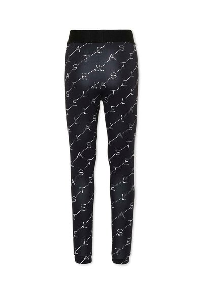 Pantalon noir cintré avec taille et poignets élastiques, présentant un motif de texte diagonal en pointillés blancs épelant "STELLA" à plusieurs reprises.
