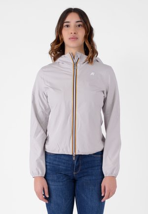 Giacca a cappuccio grigio chiaro con zip frontale, con dettagli della zip multicolore e polsini elasticizzati. Materiale liscio e leggero.