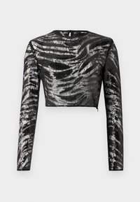 Fekete hosszú ujjú crop top, texturált, fémes ezüst mintázattal és kerek nyakkivágással, hátul cipzáros záródással.