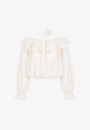 Blouse écrue à manches longues avec encolure et poignets à volants en broderie anglaise, associée à un serre-tête assorti en tissu fleuri avec lien à nouer.