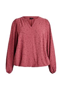 Rustfärgad blus med V-ringning, långa puffärmar och blommönster. Tillverkad av mjukt tyg med lätt struktur och samlad detalj vid ärmsluten.