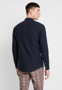 Minimum ANHOLT  granatowy