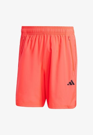 Neon pomarańczowe szorty sportowe z elastycznym pasem, dwoma bocznymi kieszeniami na zamek i czarnym logo Adidas na dolnej lewej części.