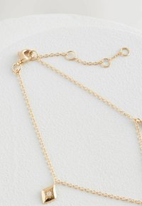 Next Karkötő - gold plated sterling silver