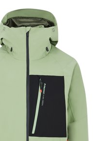 Giacca impermeabile verde chiaro con colletto alto, tasca sul petto con zip nera. Dotata di cordini regolabili e texture liscia.