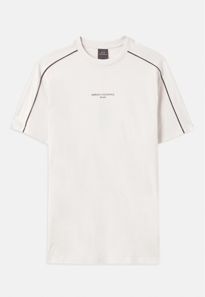 Off-white majica iz bombaža, s kratkimi rokavi, okroglo ovratnikom, kontrastnim črnim šivanjem na ramenih in natisnjenim logotipom.