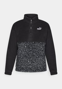Black fleece pullover with a quarter zipper. Features upper solid black section and lower leopard print in shades of gray. Puma logo on chest.