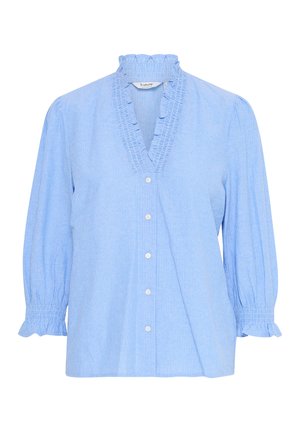 Chemise bleu clair avec des rayures verticales blanches. Présente un col à volants et des manches bouffantes élastiques, confectionnée dans un tissu doux.