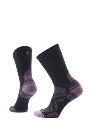 Pair of black and purple mid-calf socks with reinforced heel and toe, displayed upright on a white background.