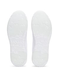 Soli di sneakers bianchi con gomma texturizzata. Presenta motivi geometrici in rilievo e branding. Forma liscia con bordi arrotondati.