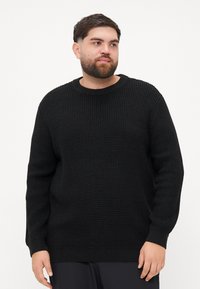 Czarny sweter wełniany z teksturowanym wzorem, z okrągłym dekoltem i długimi rękawami. Ribbowane mankiety i dół dodają szczegółów do projektu.