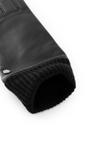 Black leather glove with knitted black wool cuff. Features a smooth surface, ribbed texture at the wrist, and a silver accent button.