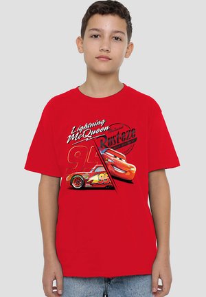 Red short-sleeve t-shirt featuring a graphic print of Lightning McQueen, the number "95," and "Rust-eze" logo in contrasting colors.