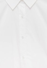 White button-up shirt with a classic collar, featuring clear plastic buttons and smooth cotton fabric texture. Simple and versatile design.