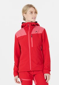 Veste extérieure rouge avec un design d'épaule rose, fermeture éclair à l'avant, capuche réglable et poches zippées pour le rangement.