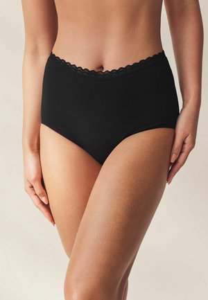 Melni biksītes ar augstu jostas vietu no mīksta auduma, ar smalku mežģīņu apšuvumu pie jostas un gludu tekstūru.