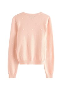 Maglione rosa chiaro con scollo a girocollo, maniche lunghe e pois testurizzati distribuiti uniformemente sul tessuto. Polsini e orlo a coste.