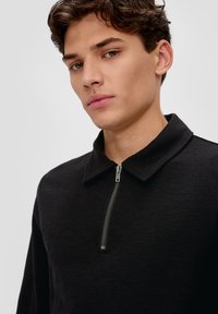 QS Poloshirt - schwarz