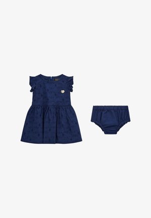 Vestido azul marino con mangas cortas con volantes, estampado floral y un adorno en forma de corazón, combinado con unos pololos azul marino a juego.