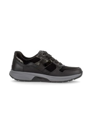 Black athletic sneaker with textured panels, lace-up closure, and a thick grey sole shown in a side profile on a white background.