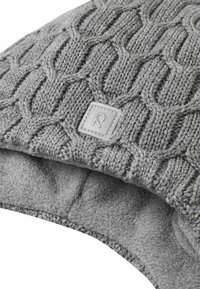 Gray knitted winter hat with cable pattern and soft fleece lining, featuring a small stitched square logo tag on the front.
