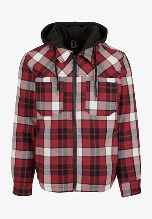 Rood en zwart geruite flanellen jas met een zwarte capuchon, voorzien van een ritssluiting aan de voorkant, twee borstzakken en elastische manchetten. Gelaagd katoen.