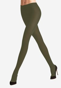 Olivgrüne, gerippte Strumpfhose mit nahtlosem Design, ausgestattet mit einem breiten Bund und glatter Textur, getragen zu schwarzen High Heels.