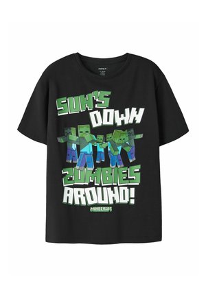 T-shirt noir avec des zombies pixelisés style Minecraft et texte "Sun's Down Zombies Around!" en lettres carrées vertes et blanches.