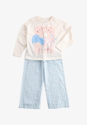 Barnets hvide langærmede top med sengetidsillustrationer og tekst kombineret med lyseblå og hvide ternede pyjamasbukser.