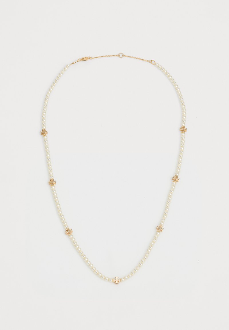 Perlový náhrdelník so zlatými akcentmi, ktorý obsahuje reťaz perál v bielej farbe s kvetinovým zlatým kovovým spracovaním. Štíhly, elegantný dizajn.