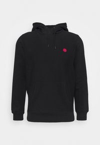 Black hoodie made of cotton blend, featuring a front pocket, drawstring hood, and a small red circle logo on the chest. Soft texture.