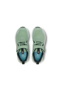 Light green athletic shoes with mesh upper, adjustable strap, black laces, and white sole. Interior features blue cushioning and branding details.