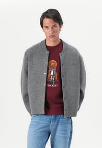 Lacoste Kardigán - pitch chine