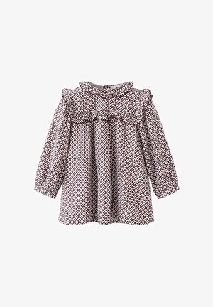 Bluză cu un model maro și alb, cu mâneci lungi și puffate, decolteu volănat și croială lejeră. Fabricată dintr-un material ușor.