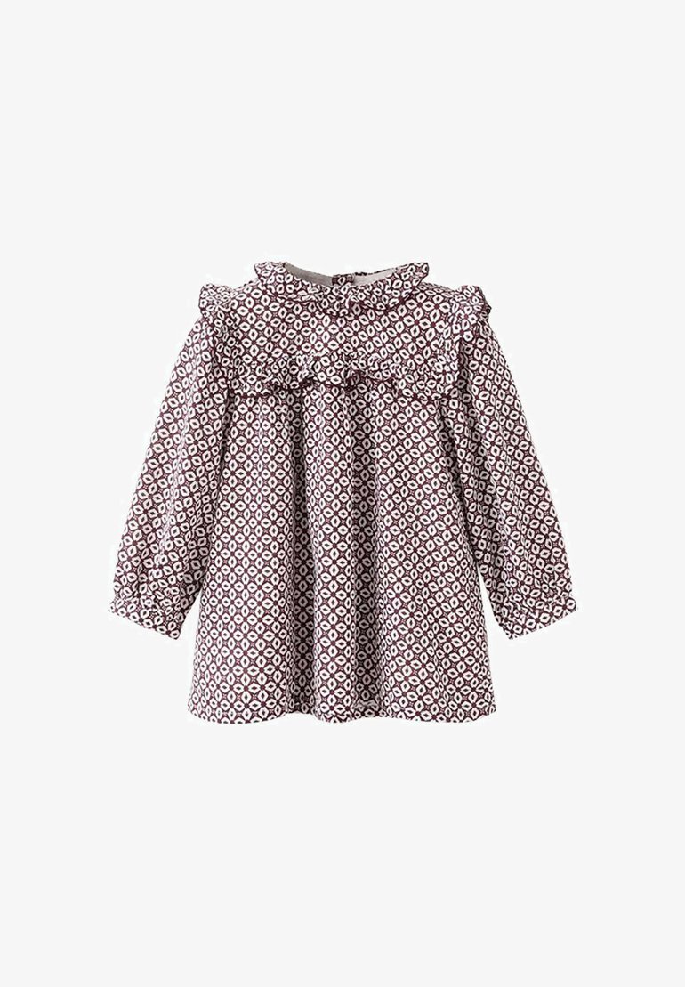 Bluse mit braun-weißer Musterung, langen Puffärmeln, rüschigem Kragen und lockerer Passform. Hergestellt aus leichtem Stoff.