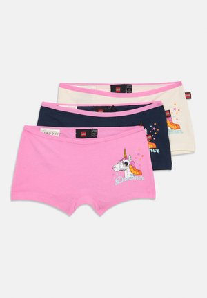Set of three cotton boxer briefs: pink with unicorn graphic, navy blue, and cream. Each has a contrasting waistband and playful designs.
