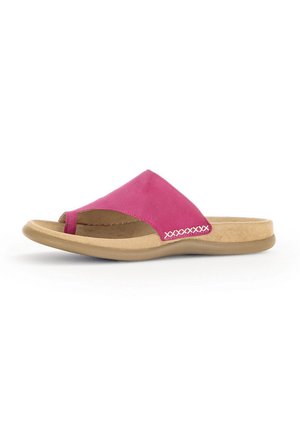 Pink suede slide sandal with a crossed strap design and beige cushioned sole. Decorative stitching detail along the side adds interest.