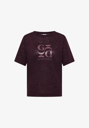 Donkerpaarse T-shirt met korte mouwen met abstracte roze vormen en de tekst "TIMES AHEAD FOLLOW your DREAMS" op de voorkant.