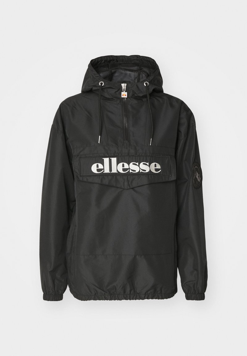 Veste coupe-vent noire à capuche avec fermeture éclair frontale, cordons, poignets élastiques et grand logo blanc ellesse sur la poche poitrine.