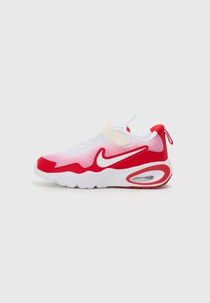 Red and white athletic shoe with mesh upper, rubber sole, strap closure, and air cushioning detail on the heel.