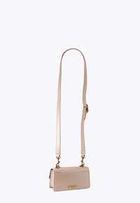 Beige leather crossbody bag with a rectangular shape, adjustable strap, gold-tone hardware, and a subtle logo plaque on the front.