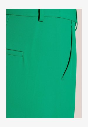 Green pants made of a smooth, stretchy fabric featuring a discreet pocket and a straight-leg design, showcasing a solid color with no patterns.