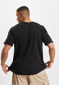 DEF EUROPEAN LEAGUE OF FOOTBALL  HELVETIC GUARDS  - Apdrukāts T-krekls - black