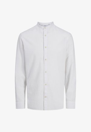 Valge linane särk mandariinikaelusega, pikkade varrukate ja nööbiga esiosa. Omab kergelt tekstureeritud kangast ja standardset lõiget.