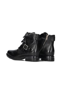 Black leather ankle boots featuring a side zipper, buckle detail, and a slightly rugged sole for traction. Folded cuff adds texture.