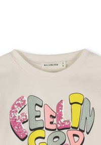 Kremna srajca z barvitimi bleščečimi črkami, ki na sprednji strani črkujejo "FEELING GOOD", velikost 6/114, blagovna znamka Billieblush.
